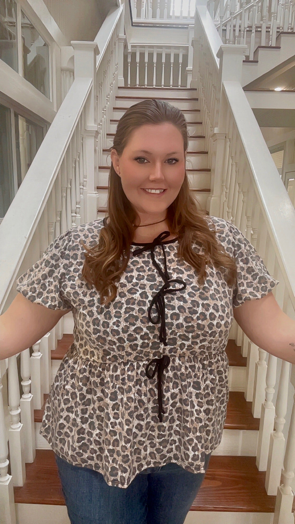 Plus knit leopard babydoll top with ribbon bow tie