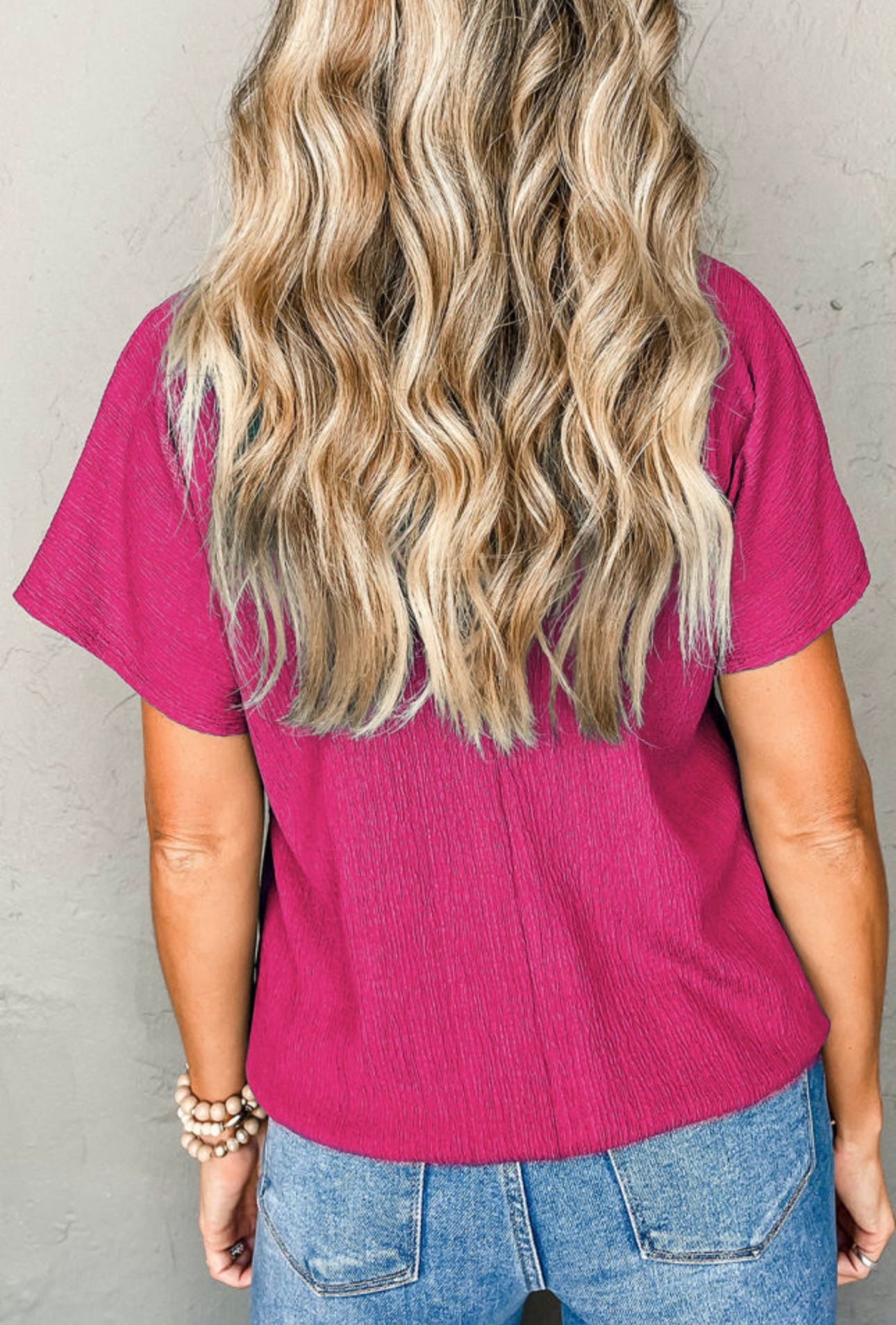 Bright pink textured v neck top plus