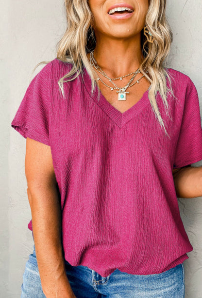 Bright pink textured v neck top plus